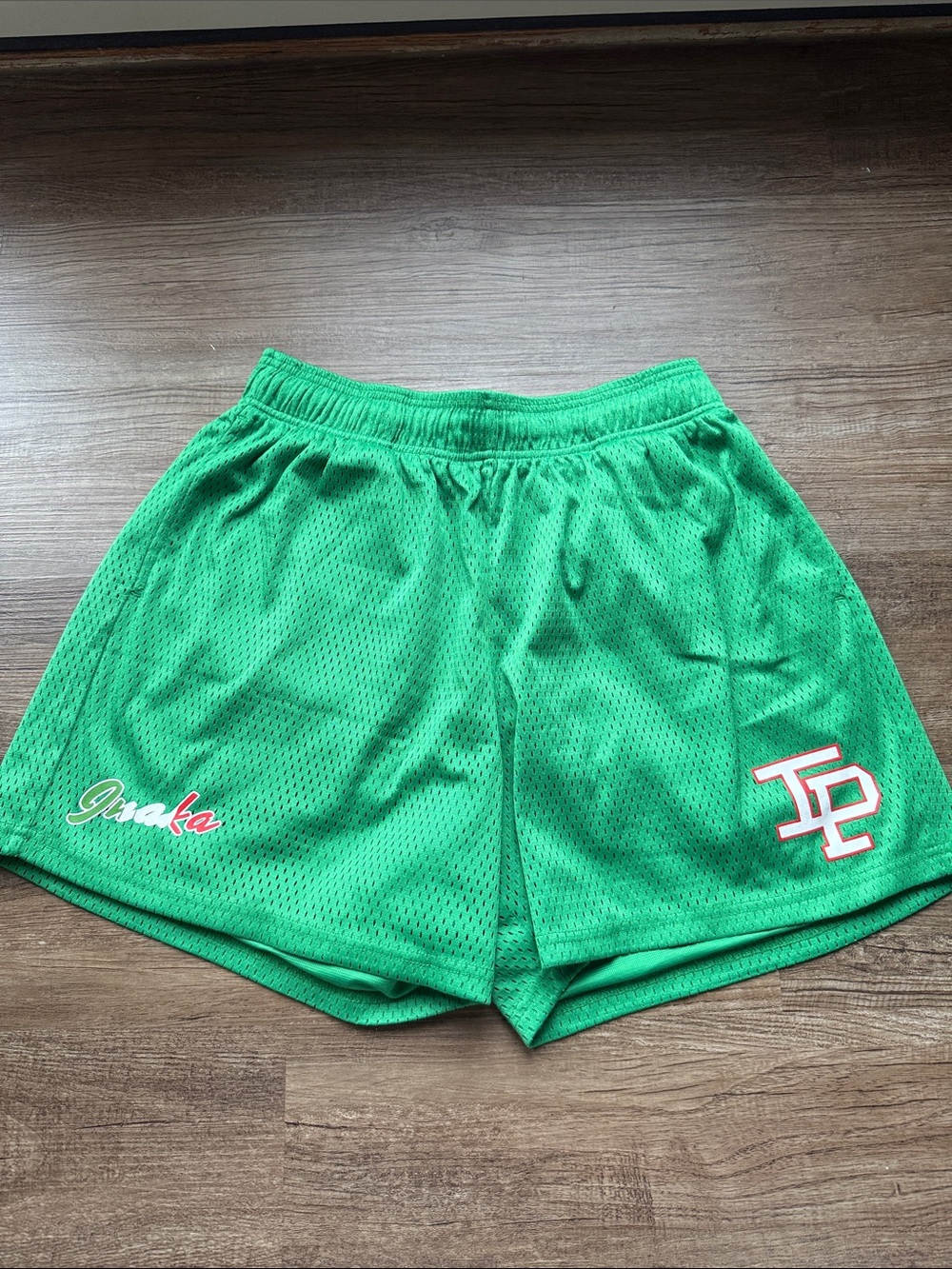Inaka Power Green Mesh Athletic Shorts with Red-White Logo